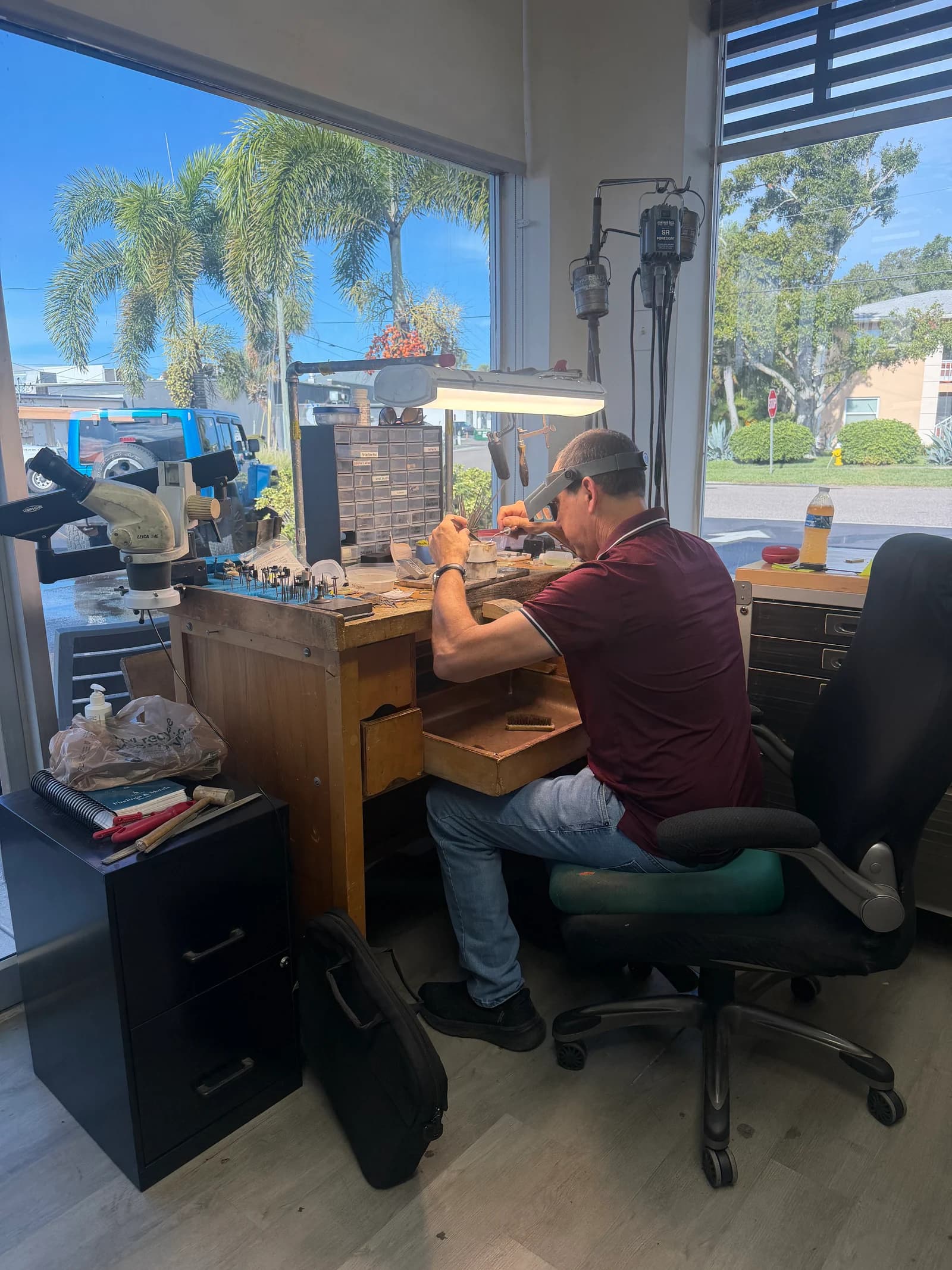 Cappello jeweler carefully working at the in-house jewelry bench